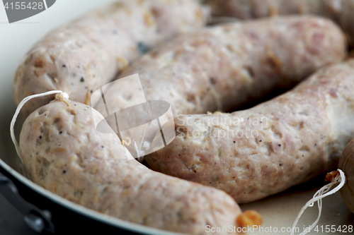 Image of  appetizing sausages close to