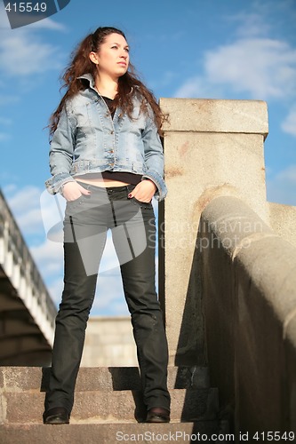 Image of brunette in jeans jacket