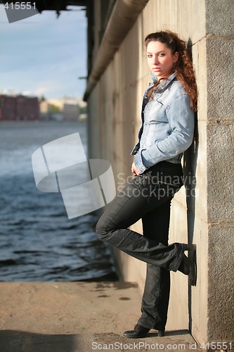 Image of beautiful brunette near water