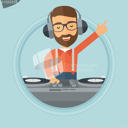 Image of Smiling DJ mixing music on turntables.