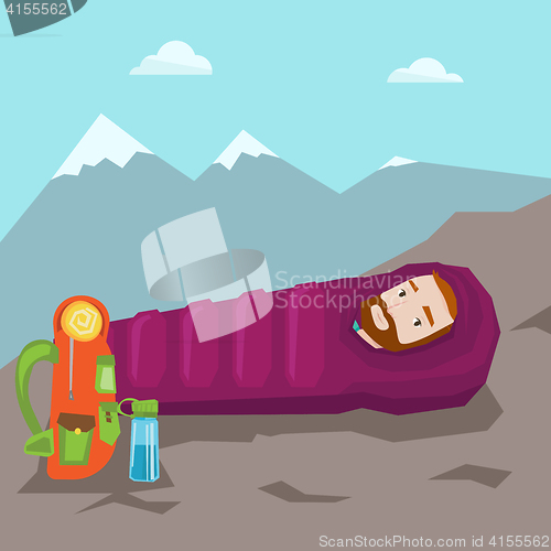 Image of Man sleeping in sleeping bag in the mountains.