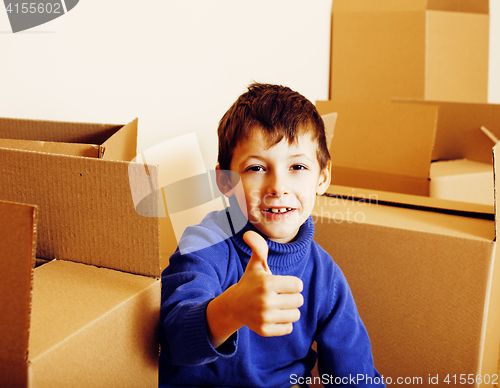 Image of little cute boy in empty room, remoove to new house. home alone, lifestyle people concept