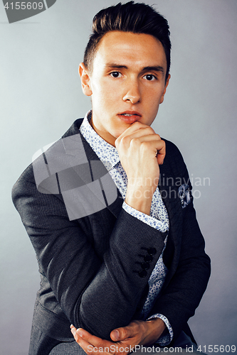 Image of young pretty business man standing on white background, modern hairstyle, posing emotional, lifestyle people concept