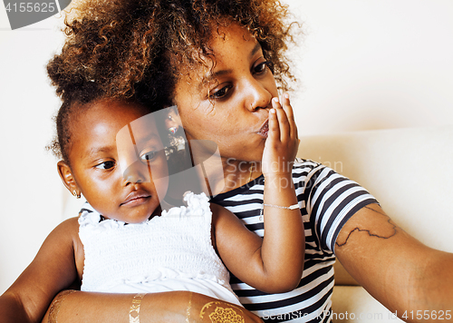 Image of adorable sweet young afro-american mother with cute little daugh