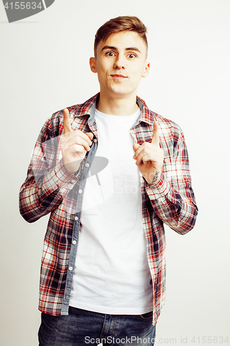 Image of young handsome teenage hipster guy posing emotional, happy smiling against white background isolated, lifestyle people concept