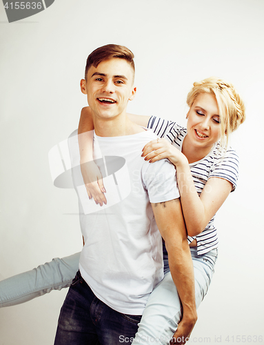 Image of young pretty teenage couple, hipster guy with his girlfriend happy smiling and hugging isolated on white background, lifestyle people concept