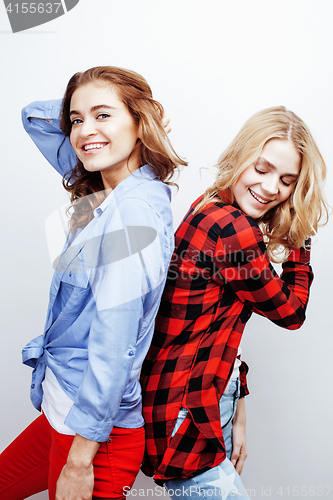 Image of two pretty blond woman having fun together on white background, mature mother and young teenage daughter, lifestyle people concept