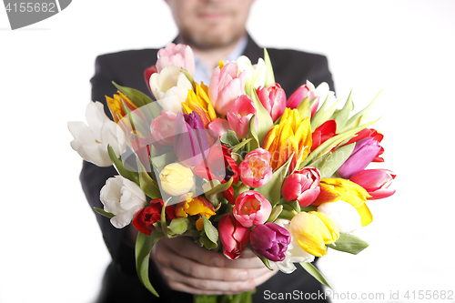 Image of Male hand with bouquet of tulips, isolated