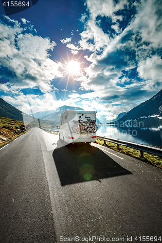 Image of Caravan car travels on the highway.