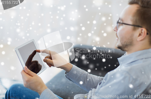 Image of man with tablet pc at home