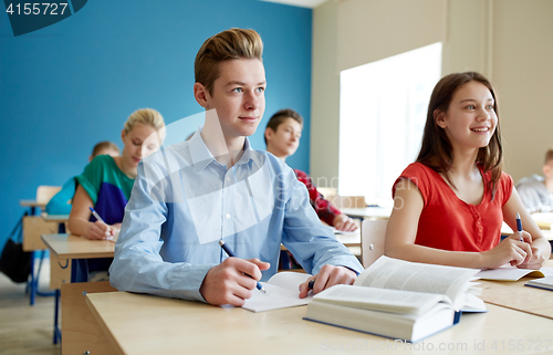 Image of group of students with books at school lesson