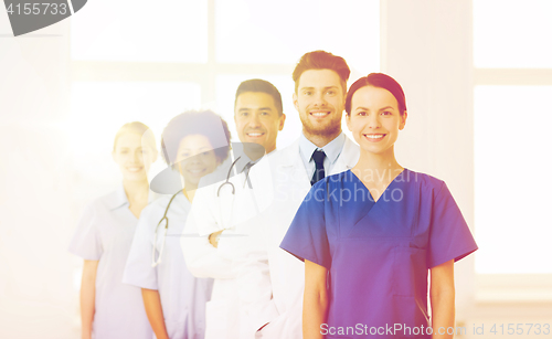 Image of group of happy doctors at hospital