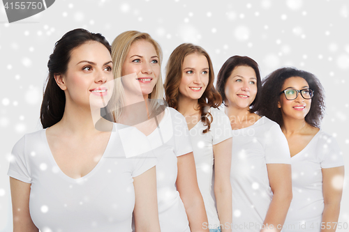 Image of group of happy different women in white t-shirts