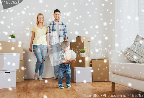 Image of happy family moving to new home and playing ball