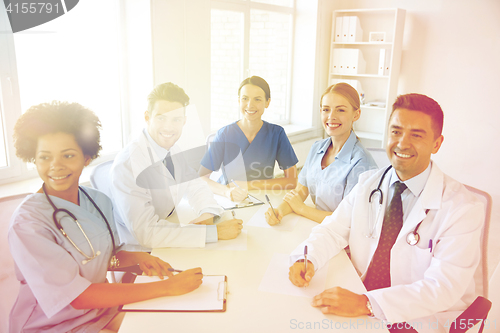 Image of group of happy doctors meeting at hospital office