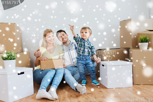 Image of happy family with boxes moving to new home