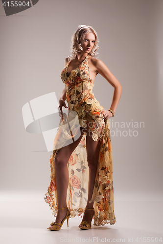 Image of Young beautiful woman in fashionable dress