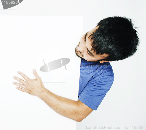 Image of pretty cool asian man holding empty white plate smiling