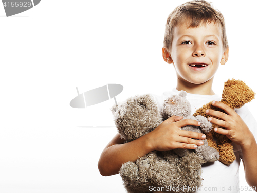 Image of little cute boy with many teddy bears hugging isolated close up