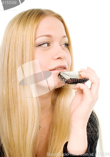 Image of blond woman with a harmonica