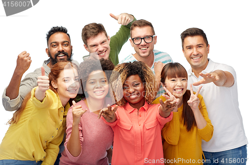 Image of international group of people showing thumbs up