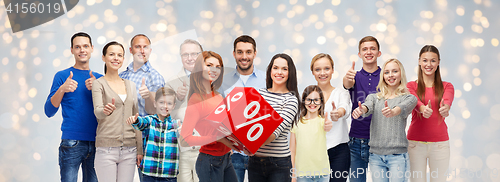 Image of happy people with percent sign showing thumbs up