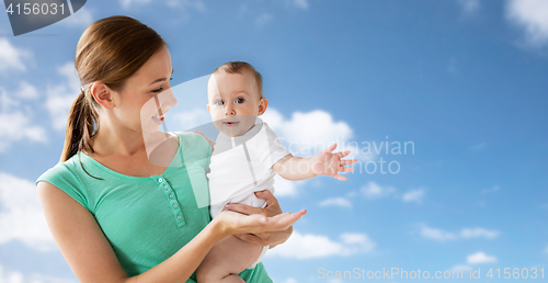 Image of happy young mother with little baby