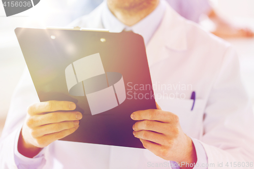 Image of close up of doctor with clipboard at hospital