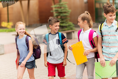 Image of group of happy elementary school students walking