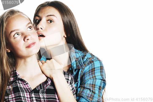 Image of two cute teenagers having fun together isolated on white