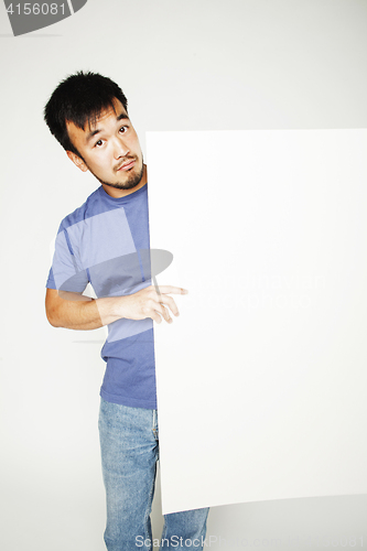 Image of pretty cool asian man holding empty white plate smiling