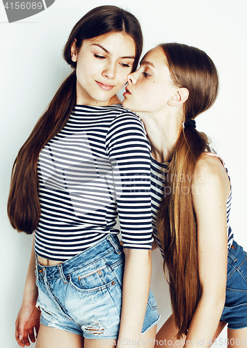 Image of two cute teenagers having fun together isolated on white