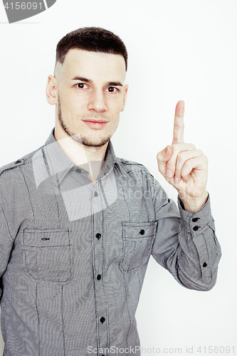 Image of young handsome well-groomed guy posing emotional on white background, lifestyle people concept