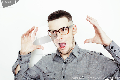 Image of young handsome well-groomed guy posing emotional on white background, lifestyle people concept