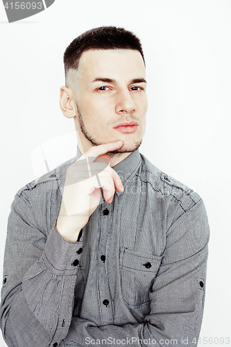 Image of young handsome well-groomed guy posing emotional on white background, lifestyle people concept