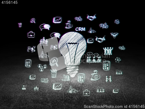 Image of Finance concept: Light Bulb in grunge dark room