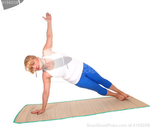 Image of Yoga trainer showing exercise poses.