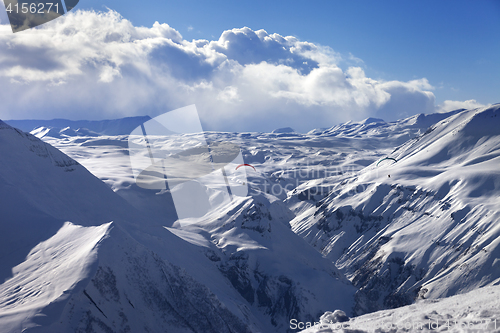 Image of Speed flying in sun winter mountains