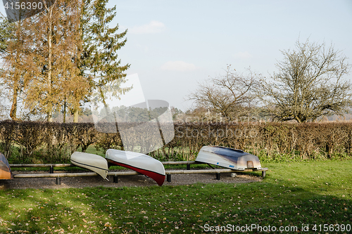 Image of Boats on a row on land