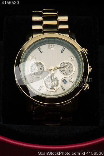 Image of gold watch isolated on black background