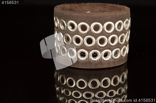 Image of Brown leather bracelet isolated on a black