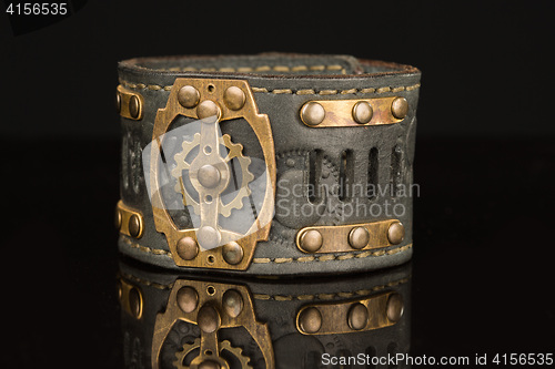 Image of Brown leather bracelet isolated on a black