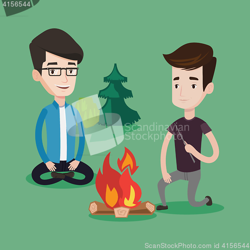 Image of Two friends sitting around bonfire in camping.