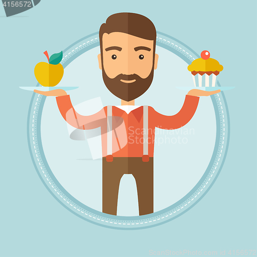 Image of Man choosing between apple and cupcake.