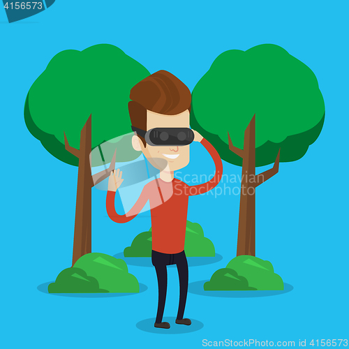 Image of Man wearing virtual reality headset in the park.