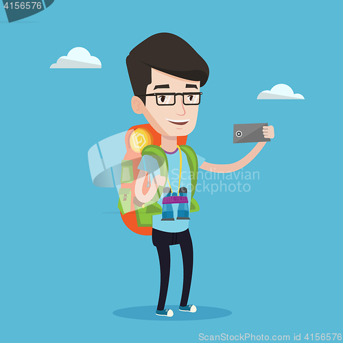 Image of Man with backpack making selfie.