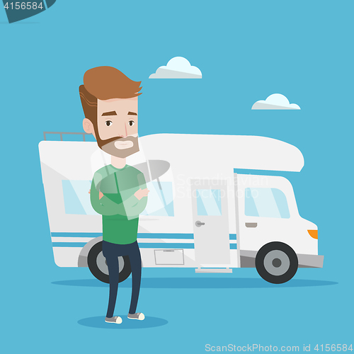 Image of Man standing in front of motor home.