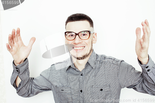 Image of young handsome well-groomed guy posing emotional on white background, lifestyle people concept