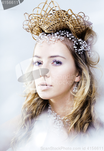 Image of beauty young snow queen in fairy flashes with crown on her head