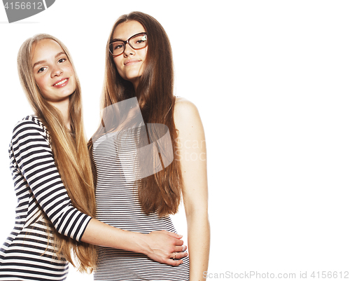 Image of two young workers isolated on white, same dresses in strip